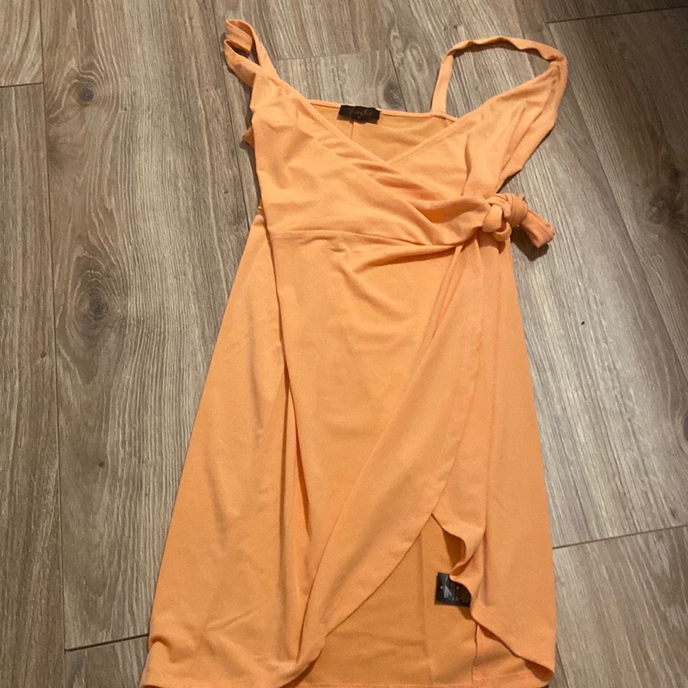 Small summer dress. Slit. Knot tie across. Peach colored.